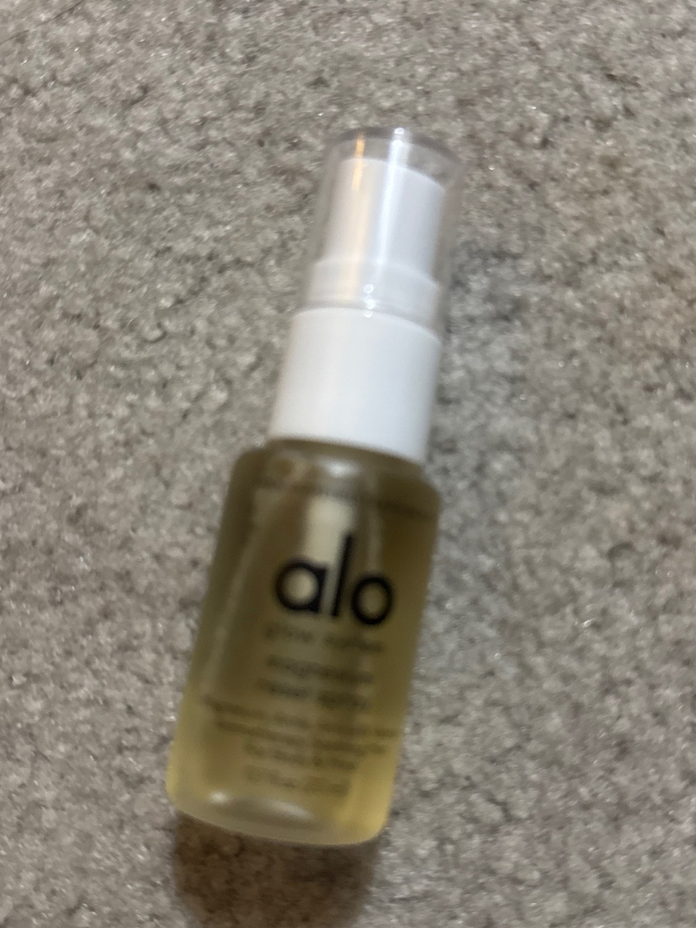 ALO Yoga Body Oil in Clear Bottle with White Pump